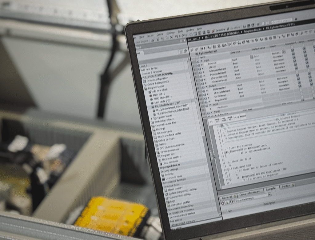 PLC Programming alongside a Control Panel
